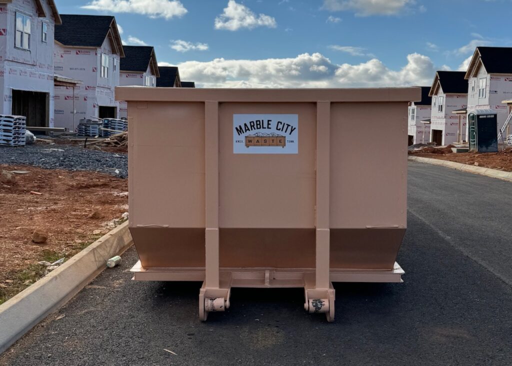 Marble City Waste roll-off dumpster on a construction site in Knoxville, TN.